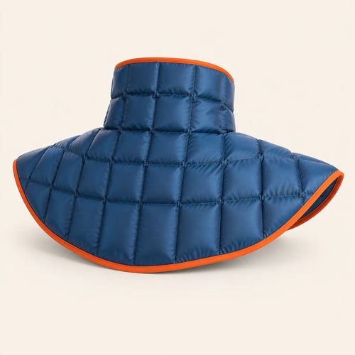Digital studio visualization of the back of the deep blue quilted DOUVANE neck-and-shoulder wrap