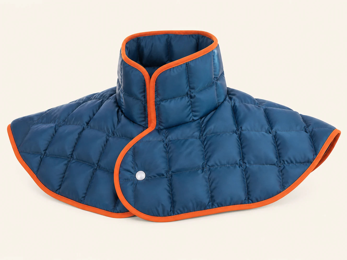 Digital studio visualization of the front of the deep blue quilted DOUVANE neck-and-shoulder wrap with orange trim
